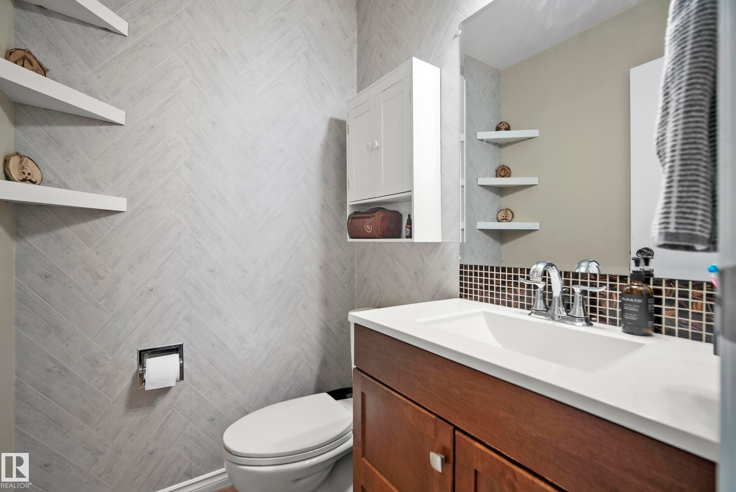 Bathroom featuring vanity and tile walls - 9221 84 Street, Fort Saskatchewan, AB - Indoor Photo Showing Bathroom