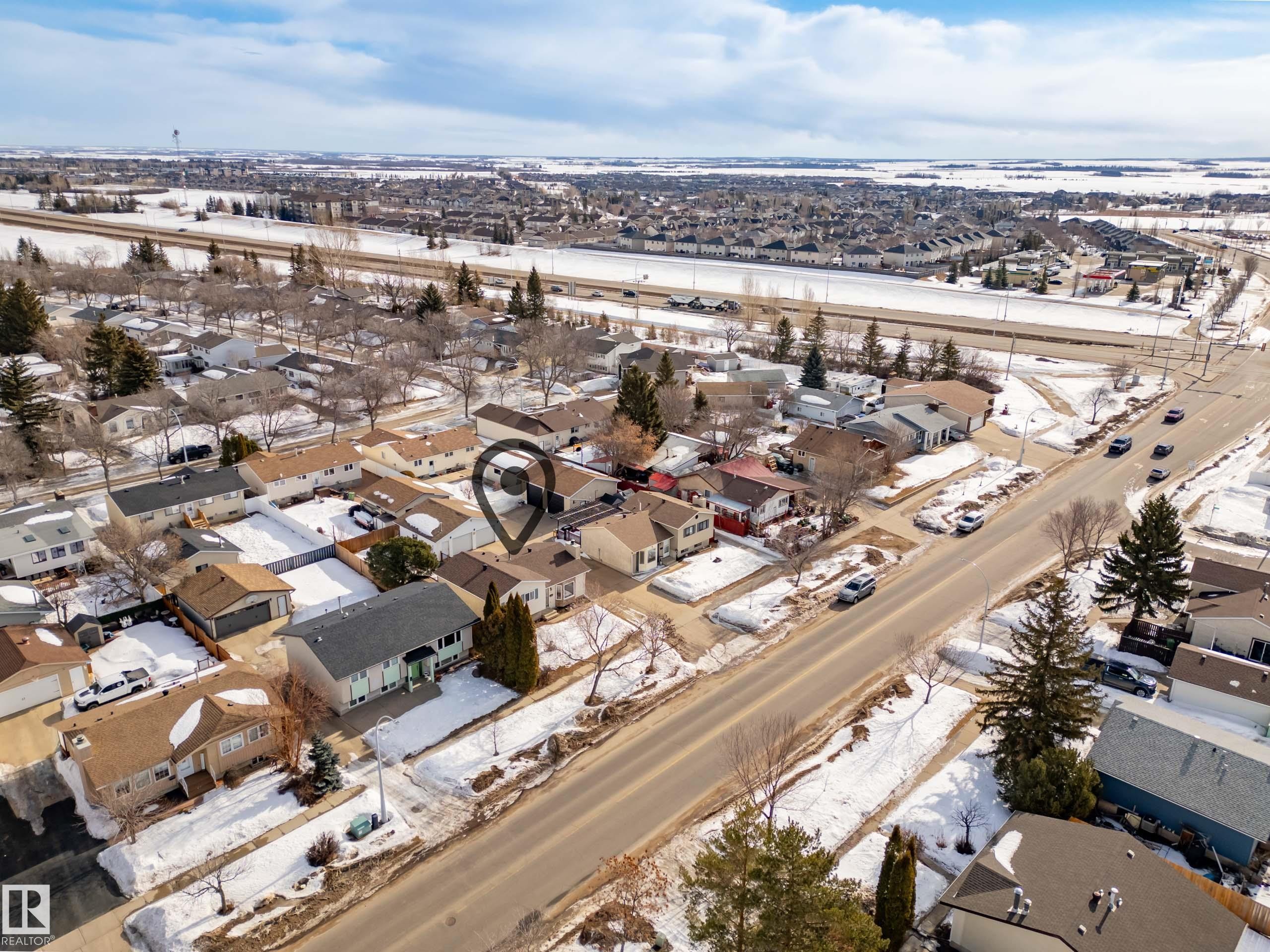 Snowy aerial view featuring a residential view - 9221 84 Street, Fort Saskatchewan, AB - Outdoor With View