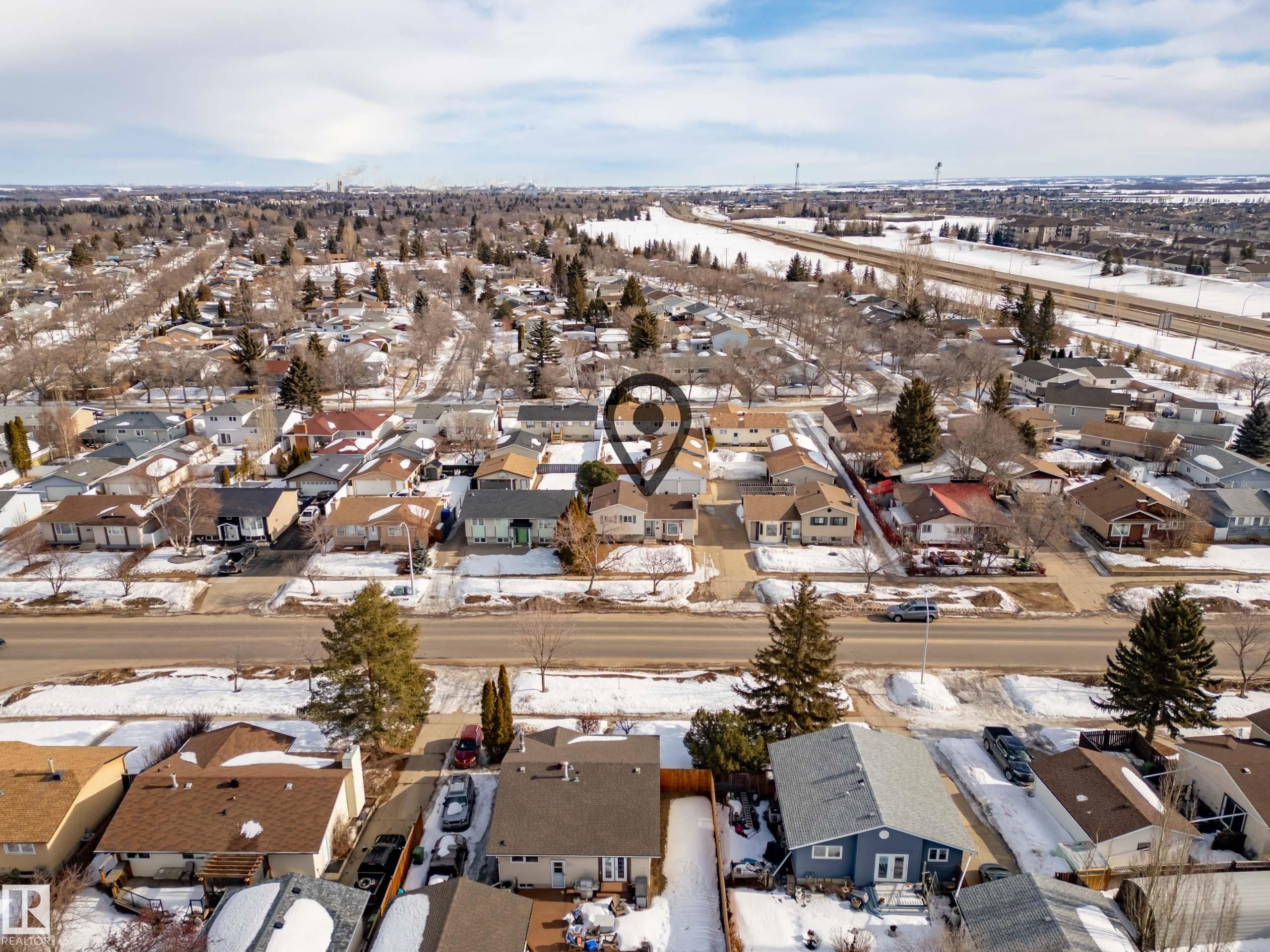 Snowy aerial view with a residential view - 9221 84 Street, Fort Saskatchewan, AB - Outdoor With View
