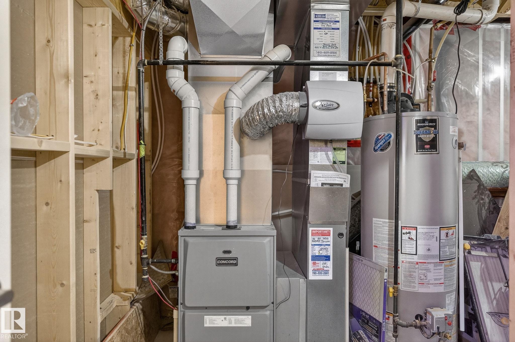 Utilities featuring water heater and heating unit - 21867 80 Avenue, Edmonton, AB - Indoor Photo Showing Basement