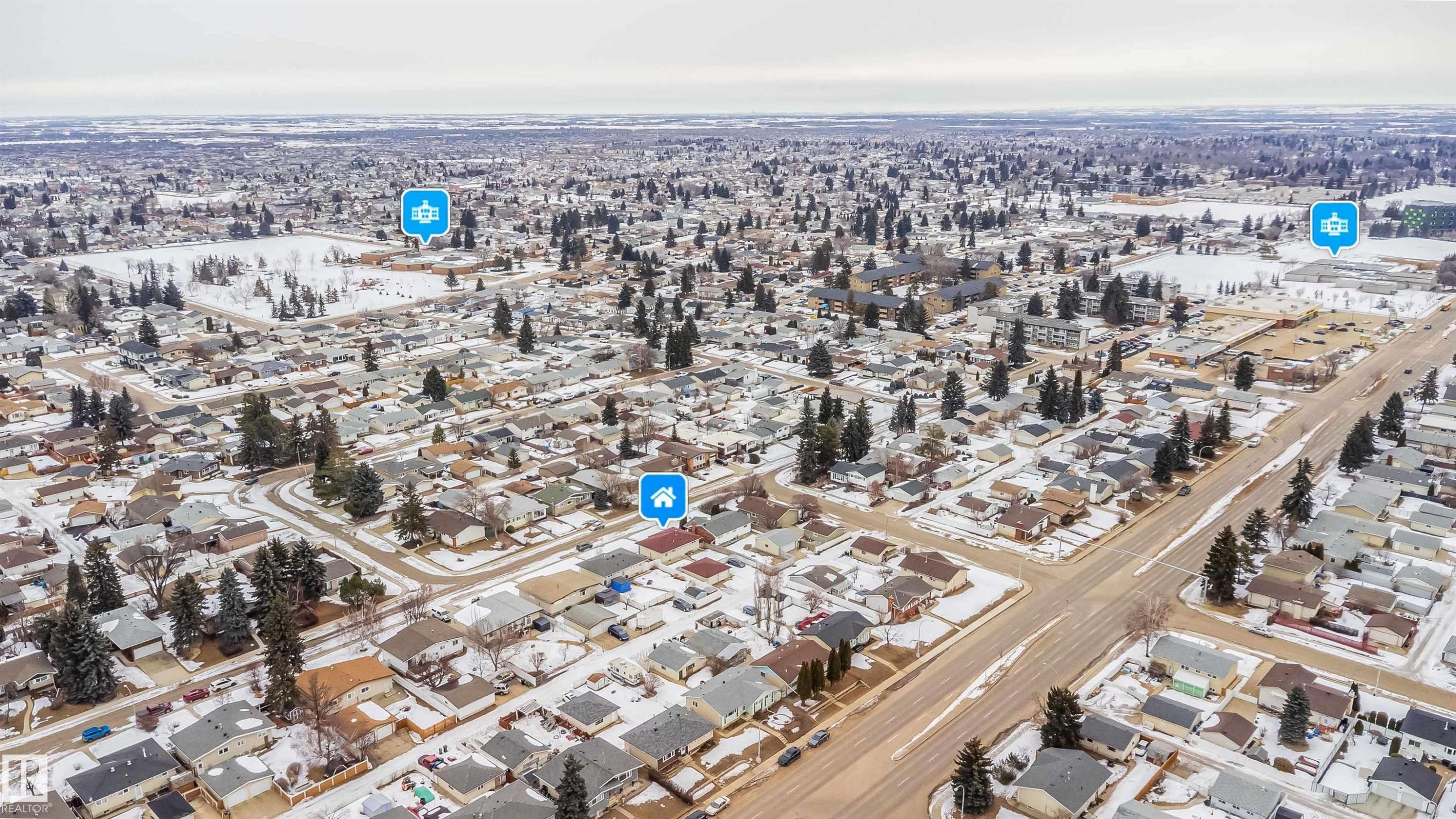 Aerial view of the neighborhood, showcasing residential properties with varying architectural styles, and a road network - 7911 145 Avenue Nw, Edmonton, AB - Outdoor With View