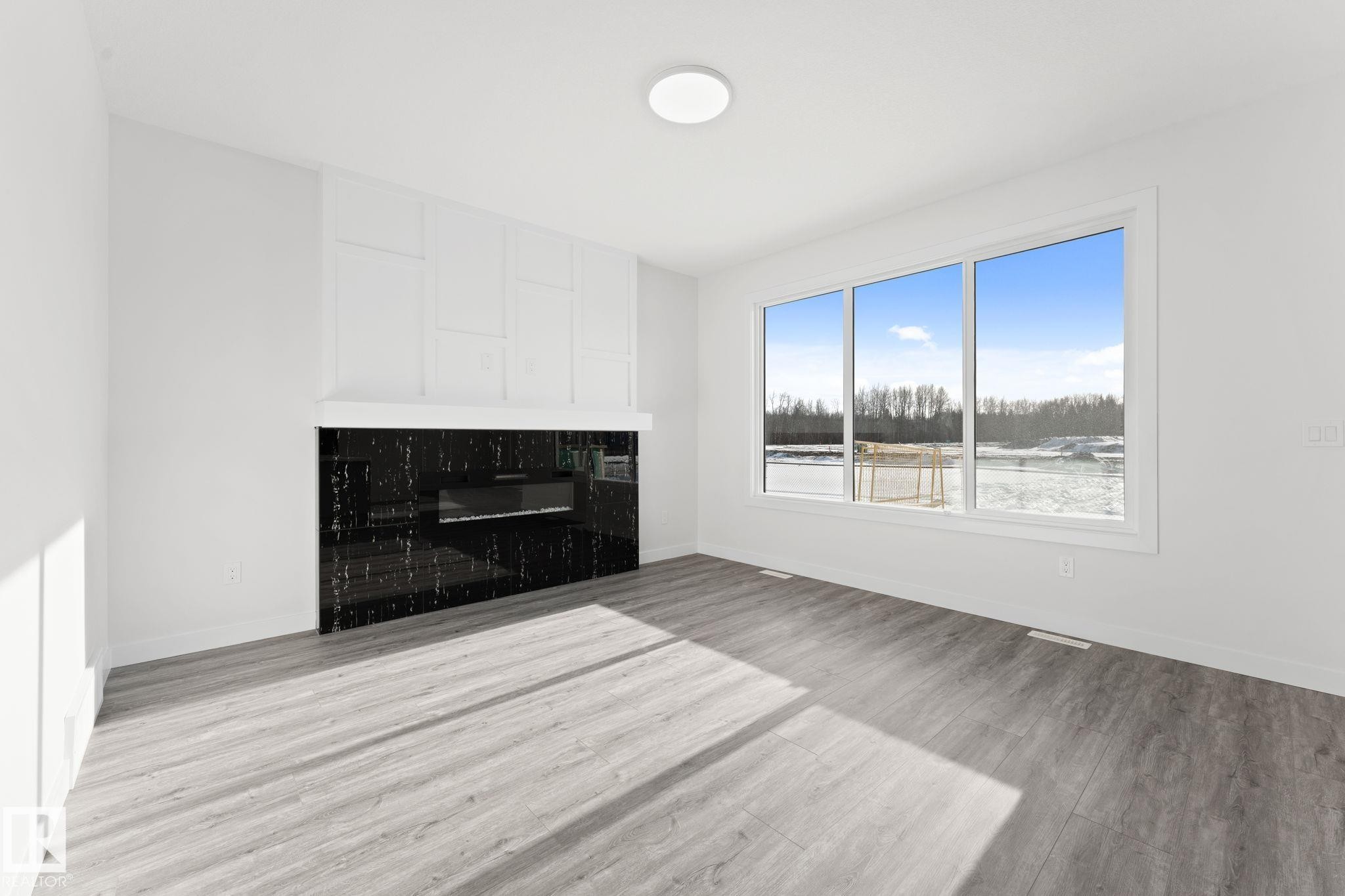 3 Pierwyck Loop, Spruce Grove, AB - Indoor Photo Showing Living Room With Fireplace