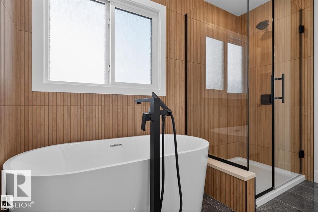 Bathroom featuring a shower stall and a freestanding tub - 45 Rosa Crescent, St. Albert, AB - Indoor