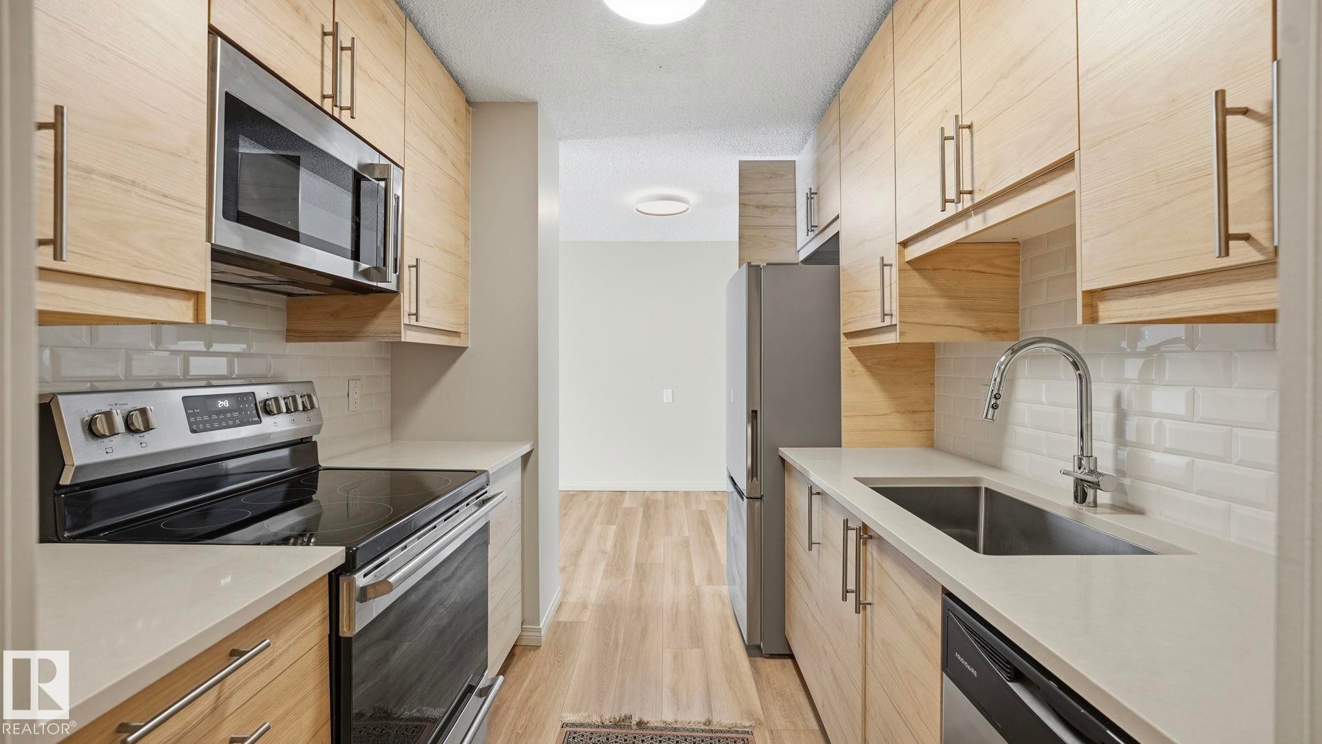 406 12121 Jasper Avenue, Edmonton, AB - Indoor Photo Showing Kitchen With Upgraded Kitchen