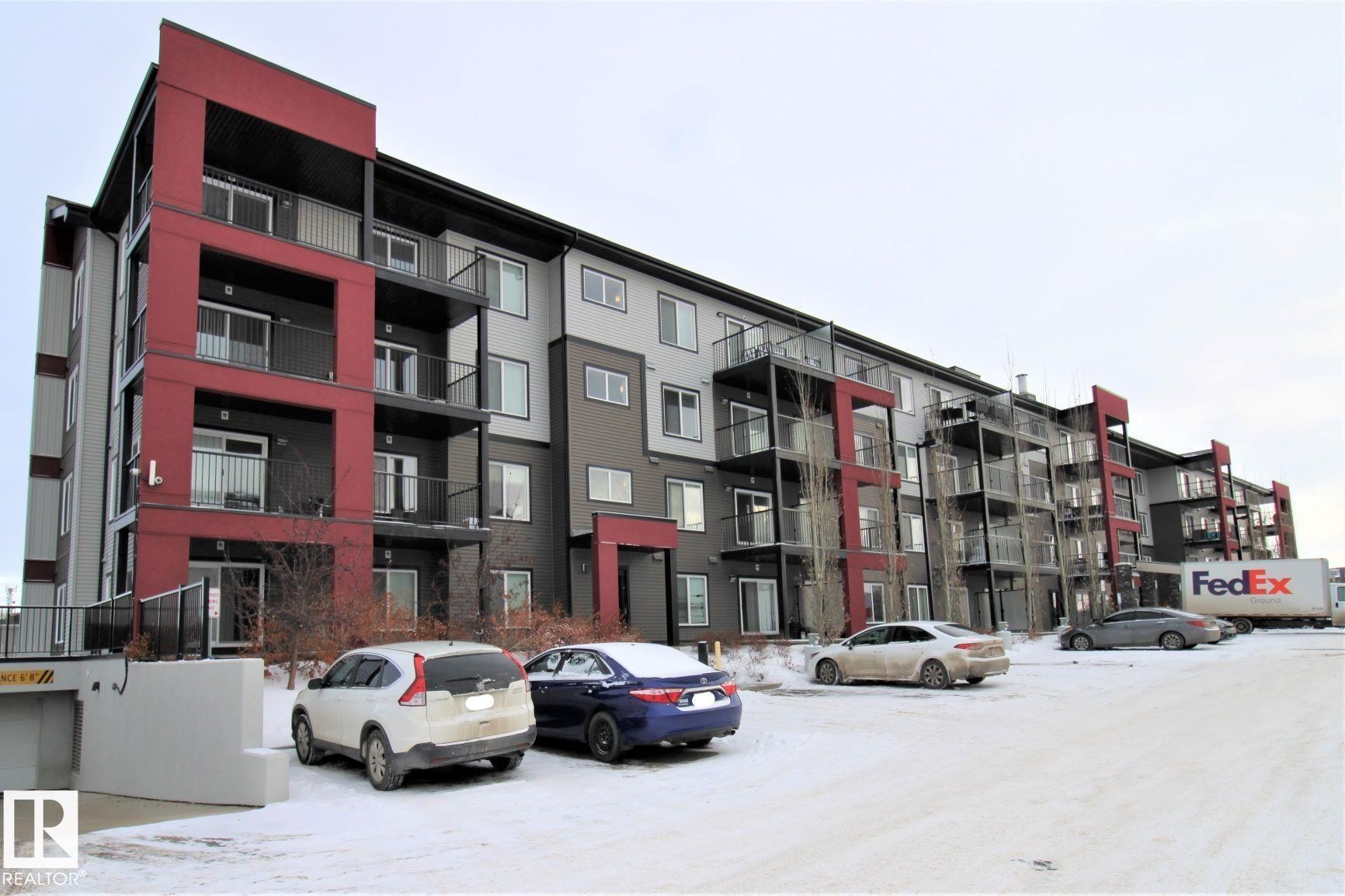 View of apartment building / complex with uncovered parking - 430 5515 7 Avenue, Edmonton, AB - Outdoor With Balcony With Facade