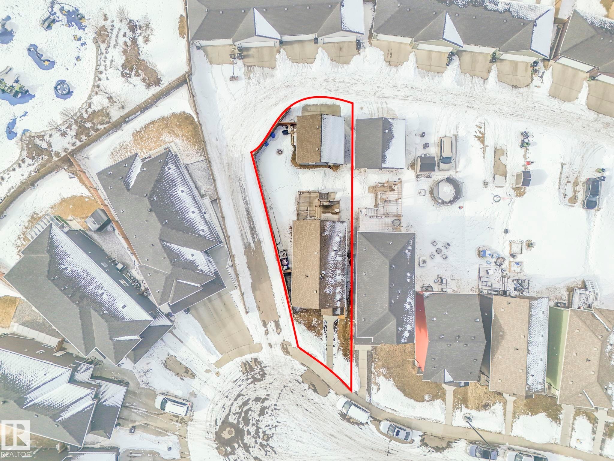 Snowy aerial view with property parcel outlined and a residential view - 2428 Wonnacott Crest, Edmonton, AB - Other