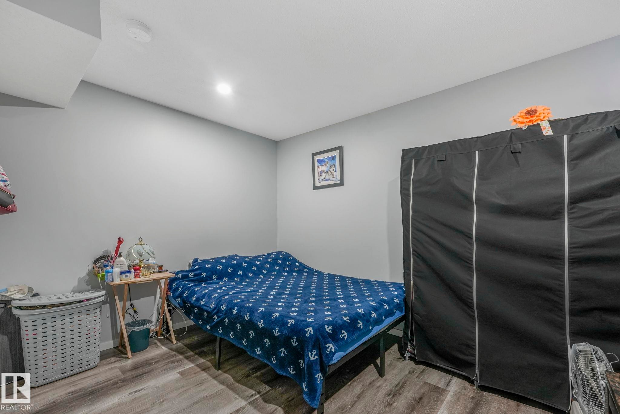 Bedroom with light wood-type flooring - 2428 Wonnacott Crest, Edmonton, AB - Indoor Photo Showing Bedroom