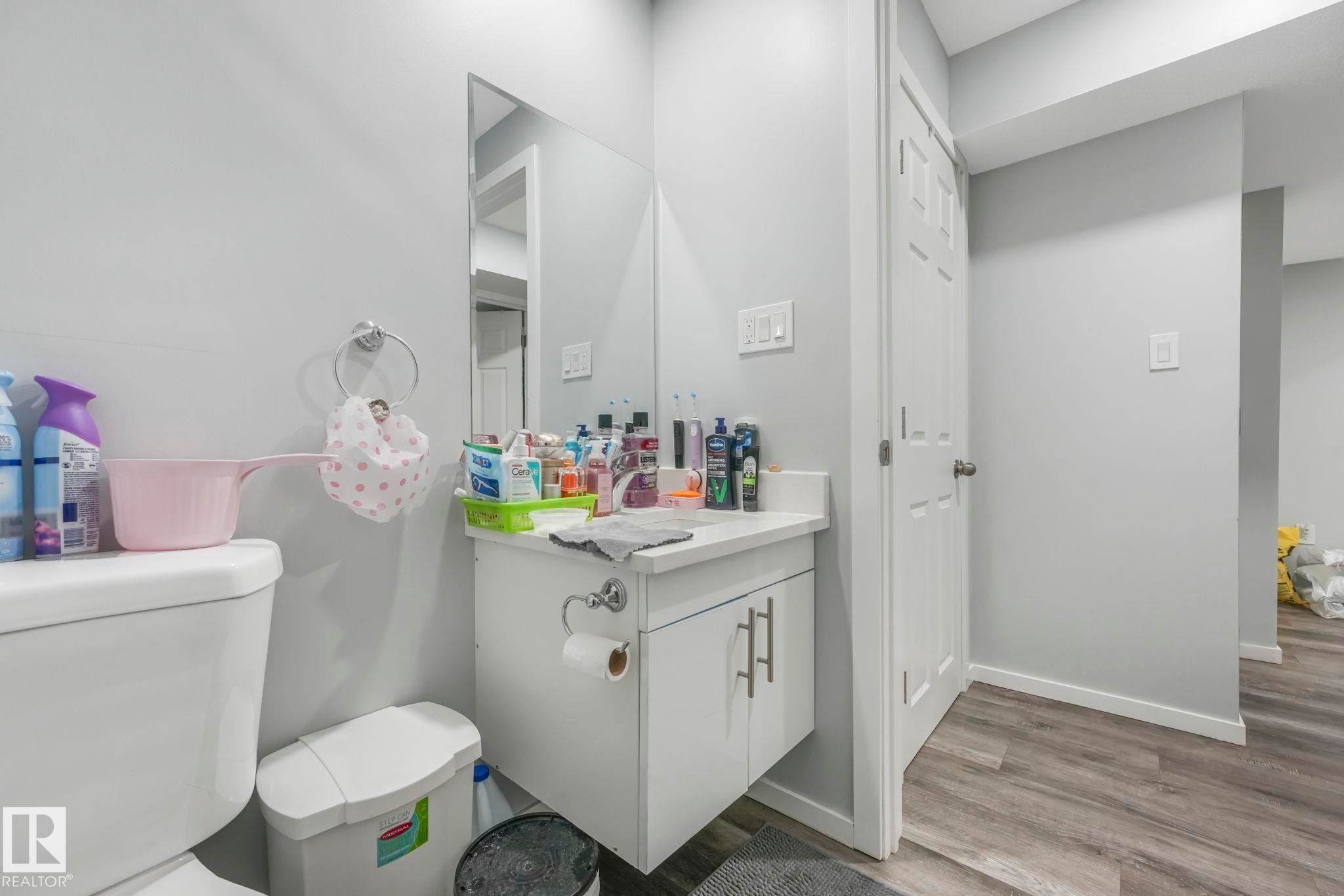 Bathroom with vanity and light wood finished floors - 2428 Wonnacott Crest, Edmonton, AB - Indoor Photo Showing Bathroom