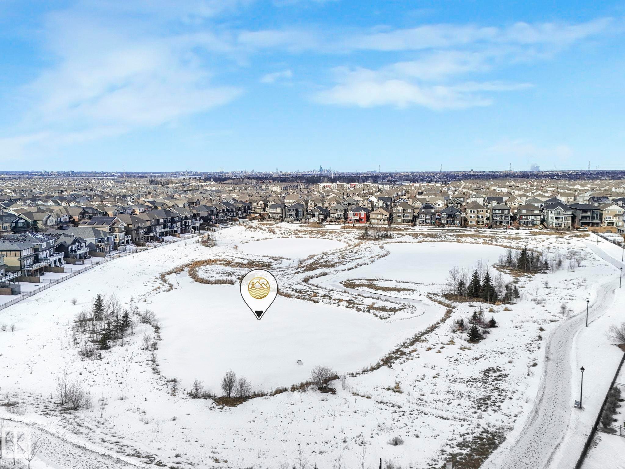 Snowy aerial view featuring a residential view - 2428 Wonnacott Crest, Edmonton, AB - Outdoor With View
