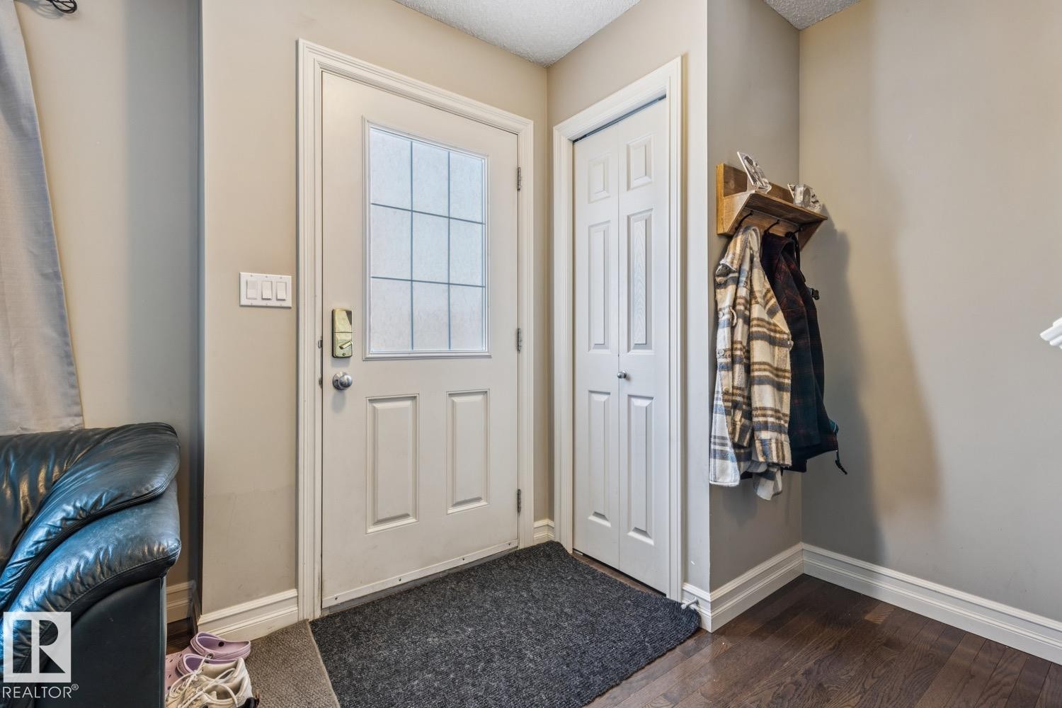 Entryway with baseboards and wood finished floors - 5409 3 Avenue, Edmonton, AB - Indoor Photo Showing Other Room