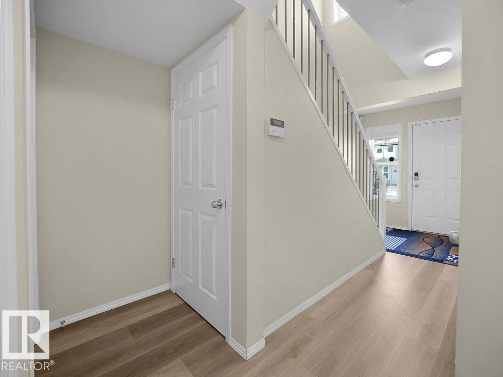 Foyer featuring light wood-style flooring - 196 230 Edwards Drive, Edmonton, AB - Indoor Photo Showing Other Room