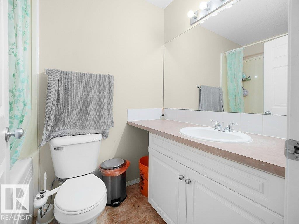 Bathroom featuring vanity and a shower with curtain - 196 230 Edwards Drive, Edmonton, AB - Indoor Photo Showing Bathroom