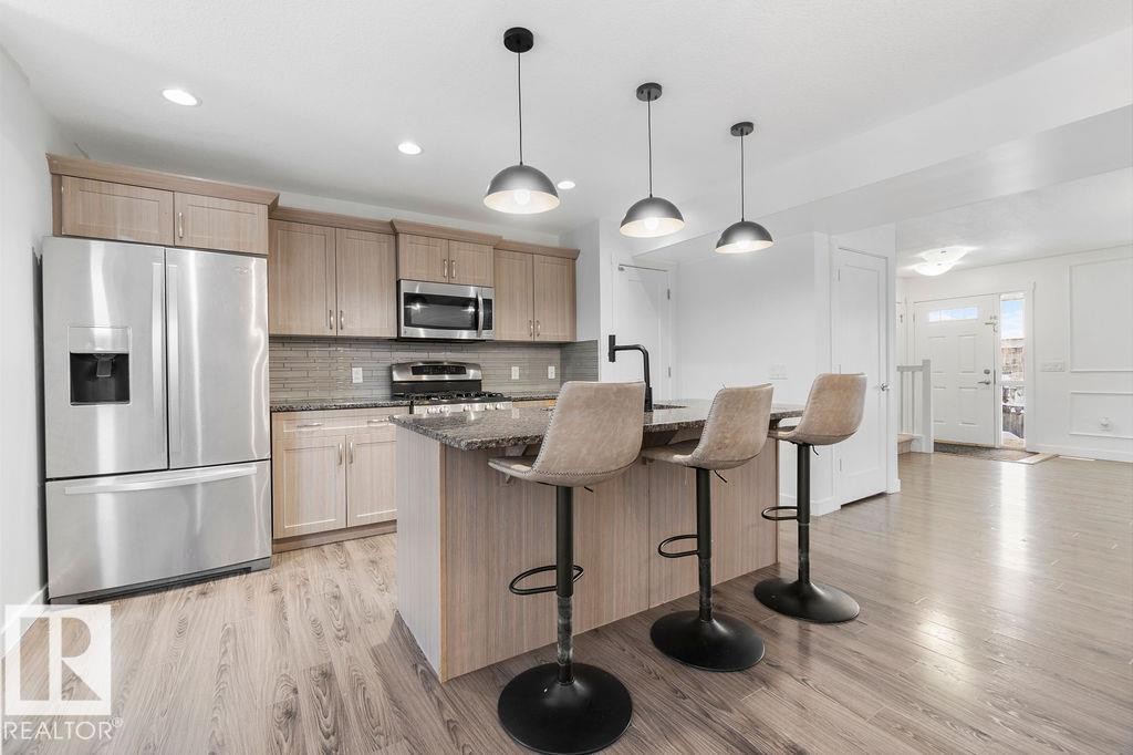 221 Cy Becker Blvd, Edmonton, AB - Indoor Photo Showing Kitchen With Upgraded Kitchen