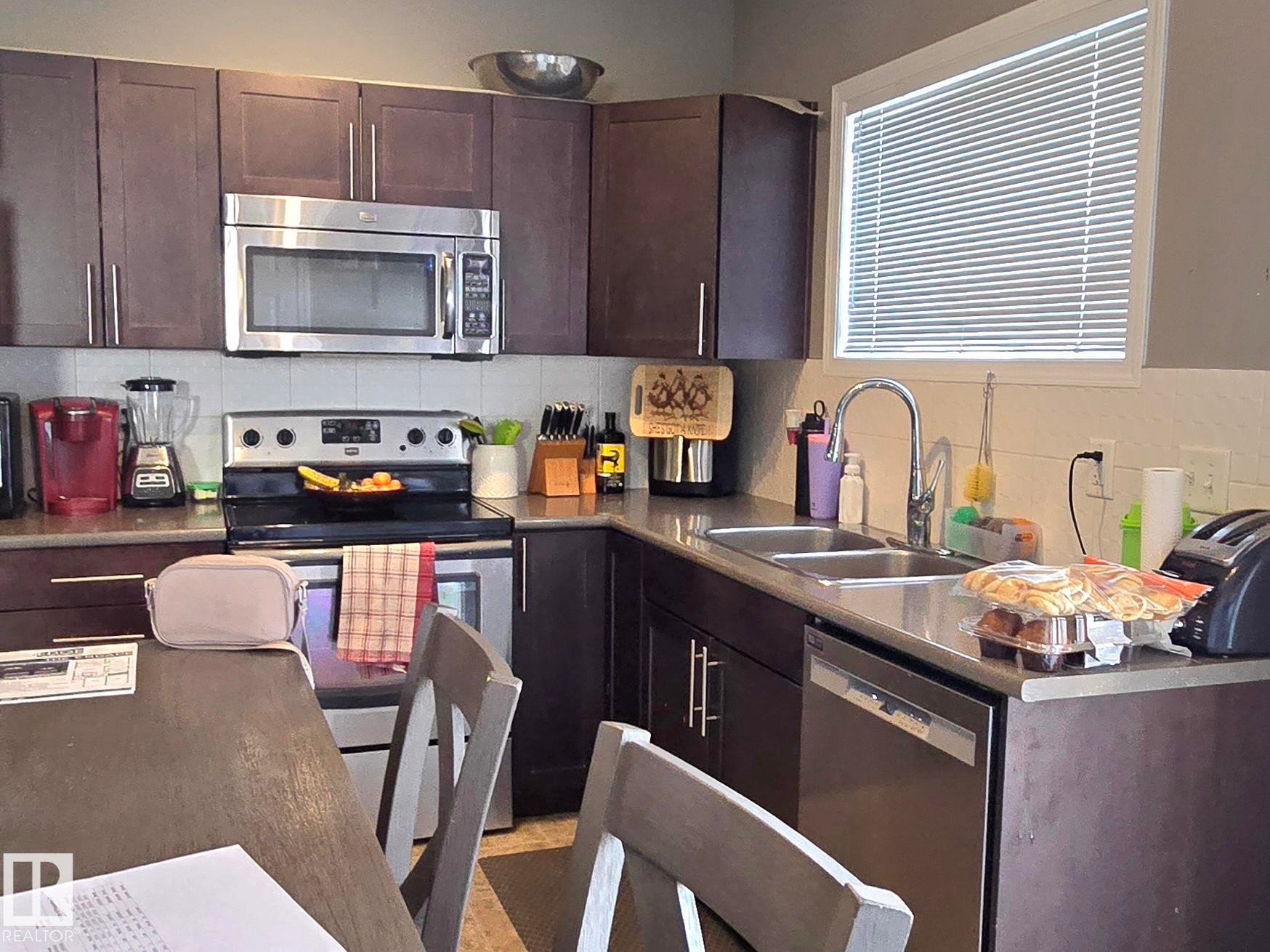 24 6520 2 Avenue Sw, Edmonton, AB - Indoor Photo Showing Kitchen With Stainless Steel Kitchen With Double Sink With Upgraded Kitchen
