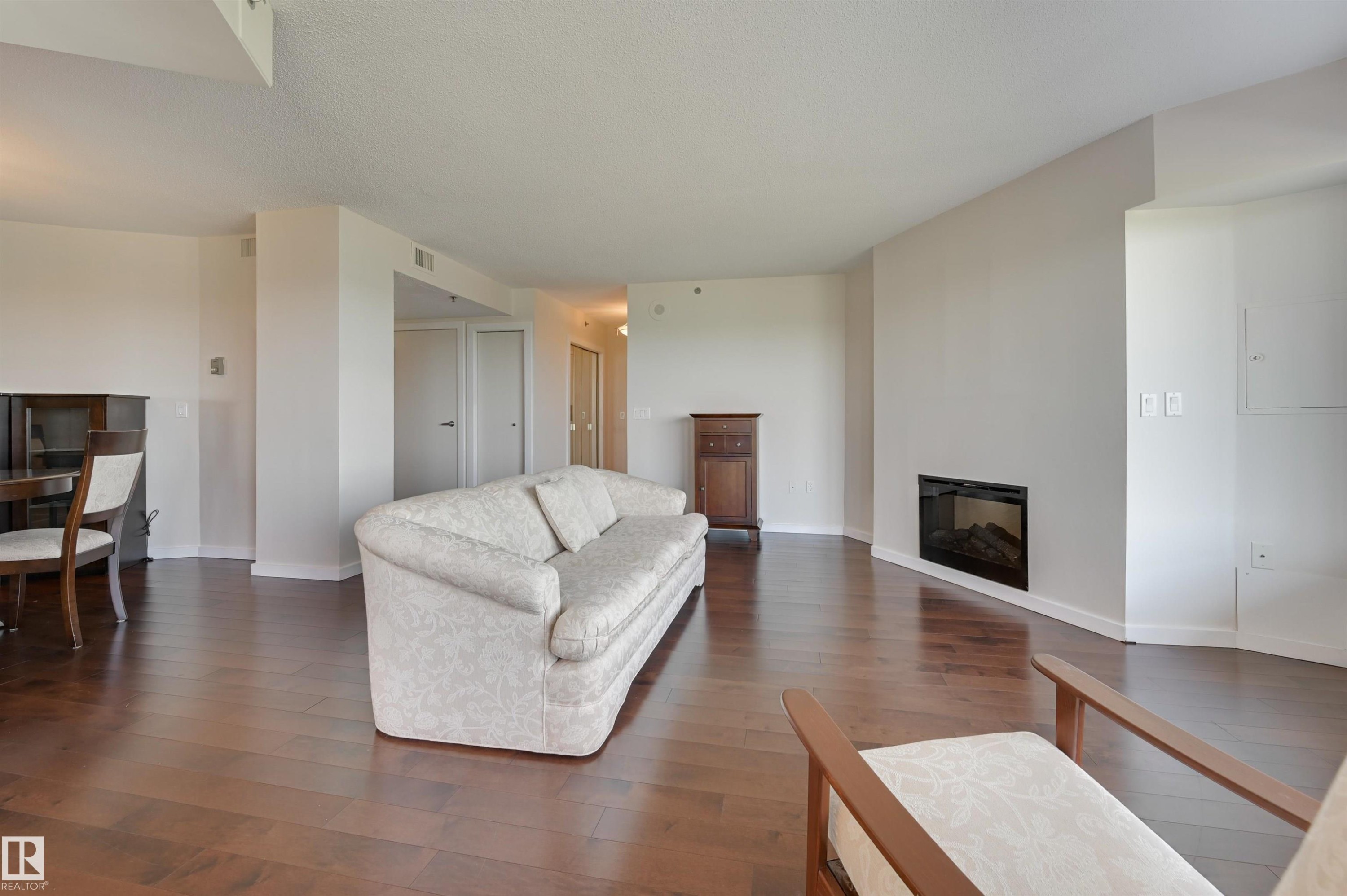 1003 12319 Jasper Avenue, Edmonton, AB - Indoor Photo Showing Living Room With Fireplace