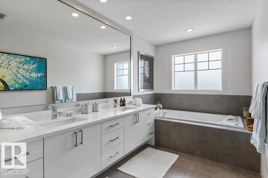 Primary Ensuite featuring Separate Glass and Tile Shower, Jacuzzi Bathtub, White Cabinets and Quartz Counters, and Separate Water Closet - 4476 Suzanna Crescent, Edmonton, AB - Indoor Photo Showing Bathroom