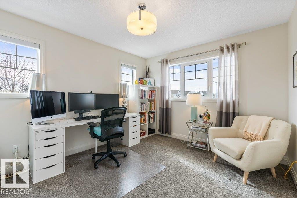Bedroom featuring South West Facing Windows, and Walk In Closet - 4476 Suzanna Crescent, Edmonton, AB - Indoor Photo Showing Office