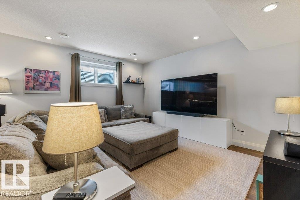 Basement Living Room in legal Secondary Suite with Open Concept to Third Kitchen Space - 4476 Suzanna Crescent, Edmonton, AB - Indoor Photo Showing Living Room