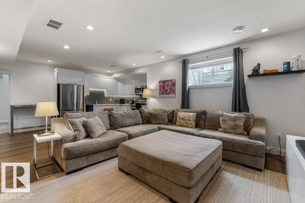 Basement Living Room in legal Secondary Suite with Open Concept to Third Kitchen Space - 4476 Suzanna Crescent, Edmonton, AB - Indoor Photo Showing Living Room