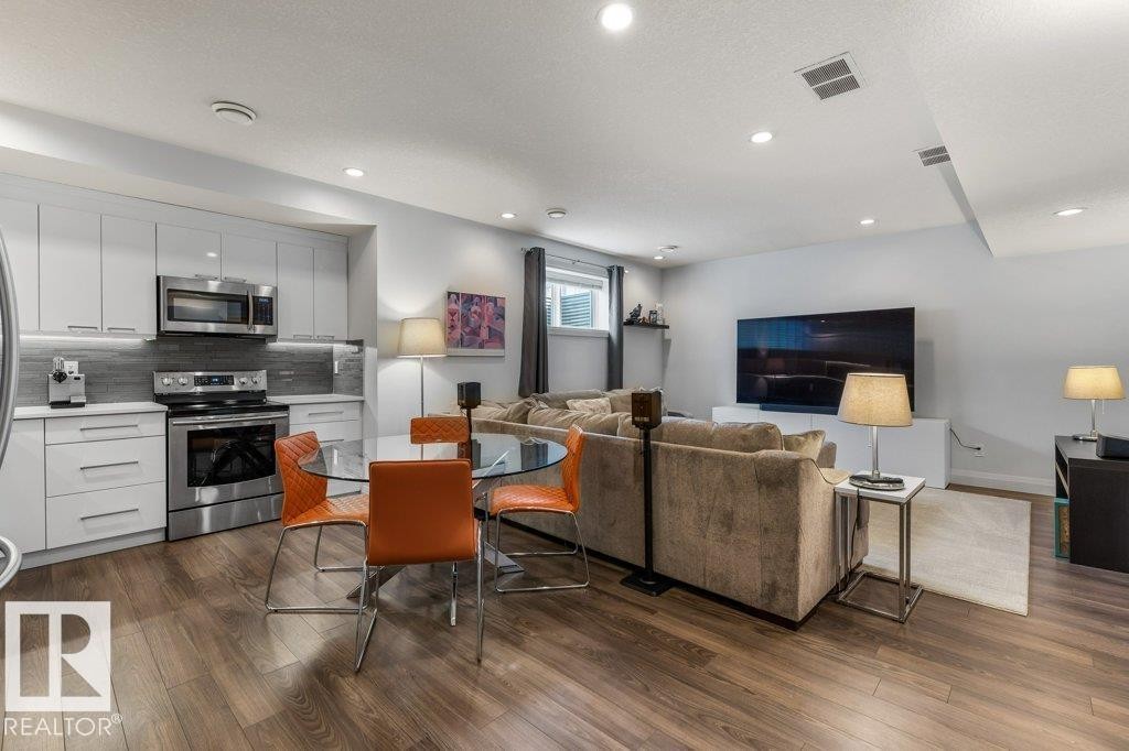 Open Concept Secondary Suite in Basement with flow from Living Room to Third Kitchen Space - 4476 Suzanna Crescent, Edmonton, AB - Indoor