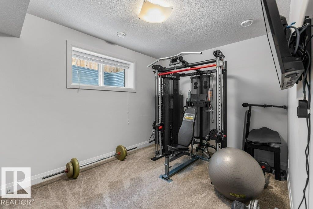 Two of Two Basement Bedrooms - 4476 Suzanna Crescent, Edmonton, AB - Indoor Photo Showing Gym Room
