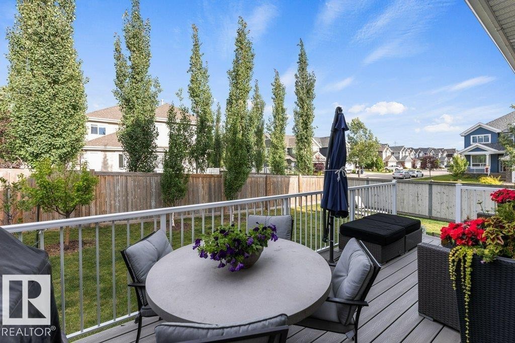 Summer view of Composite Back Deck off Kitchen - 4476 Suzanna Crescent, Edmonton, AB - Outdoor With Deck Patio Veranda