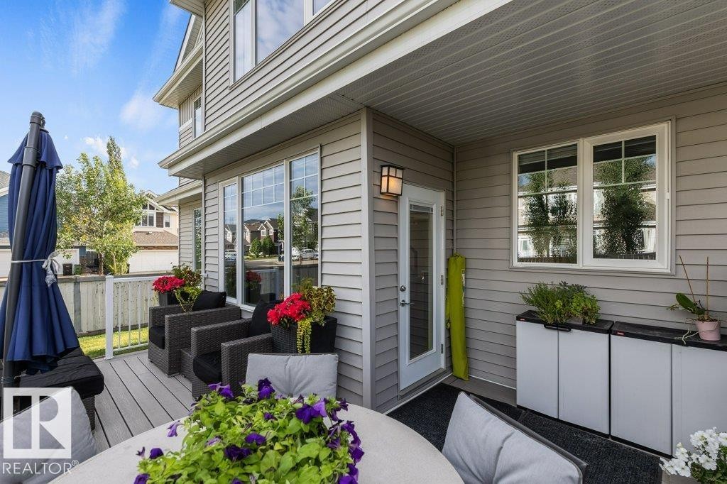 Summer view of Composite Back Deck off Kitchen - 4476 Suzanna Crescent, Edmonton, AB - Outdoor With Deck Patio Veranda With Exterior