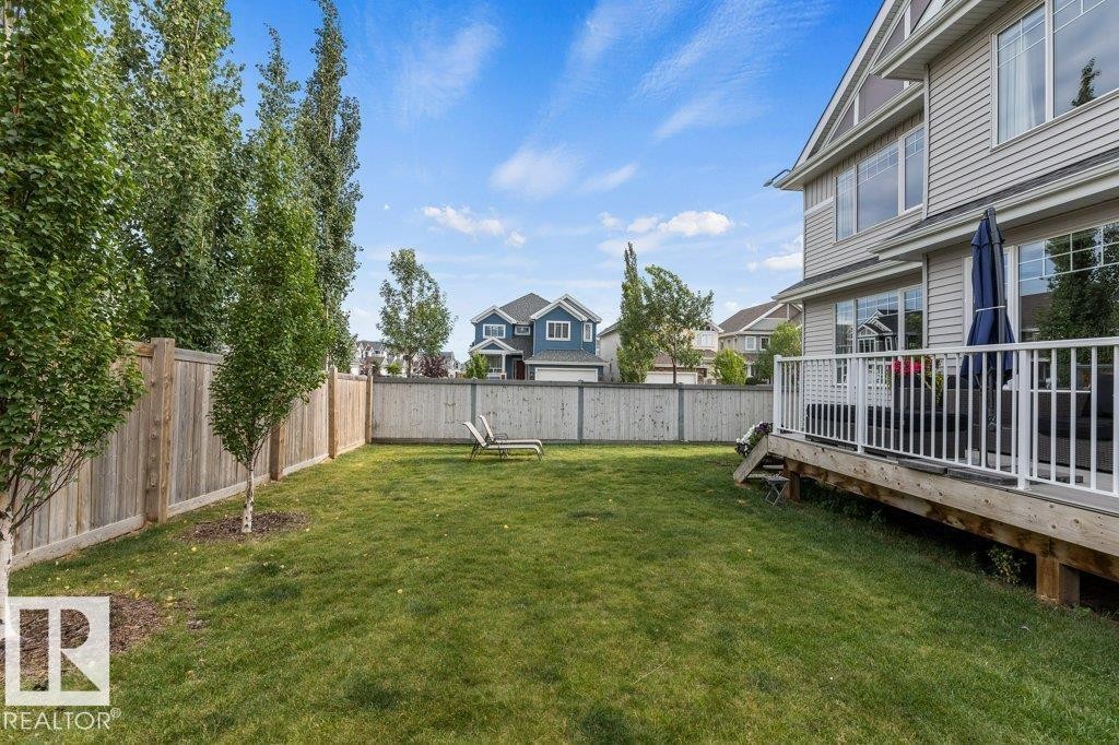 Summer View of South East Backyard - 4476 Suzanna Crescent, Edmonton, AB - Outdoor With Deck Patio Veranda