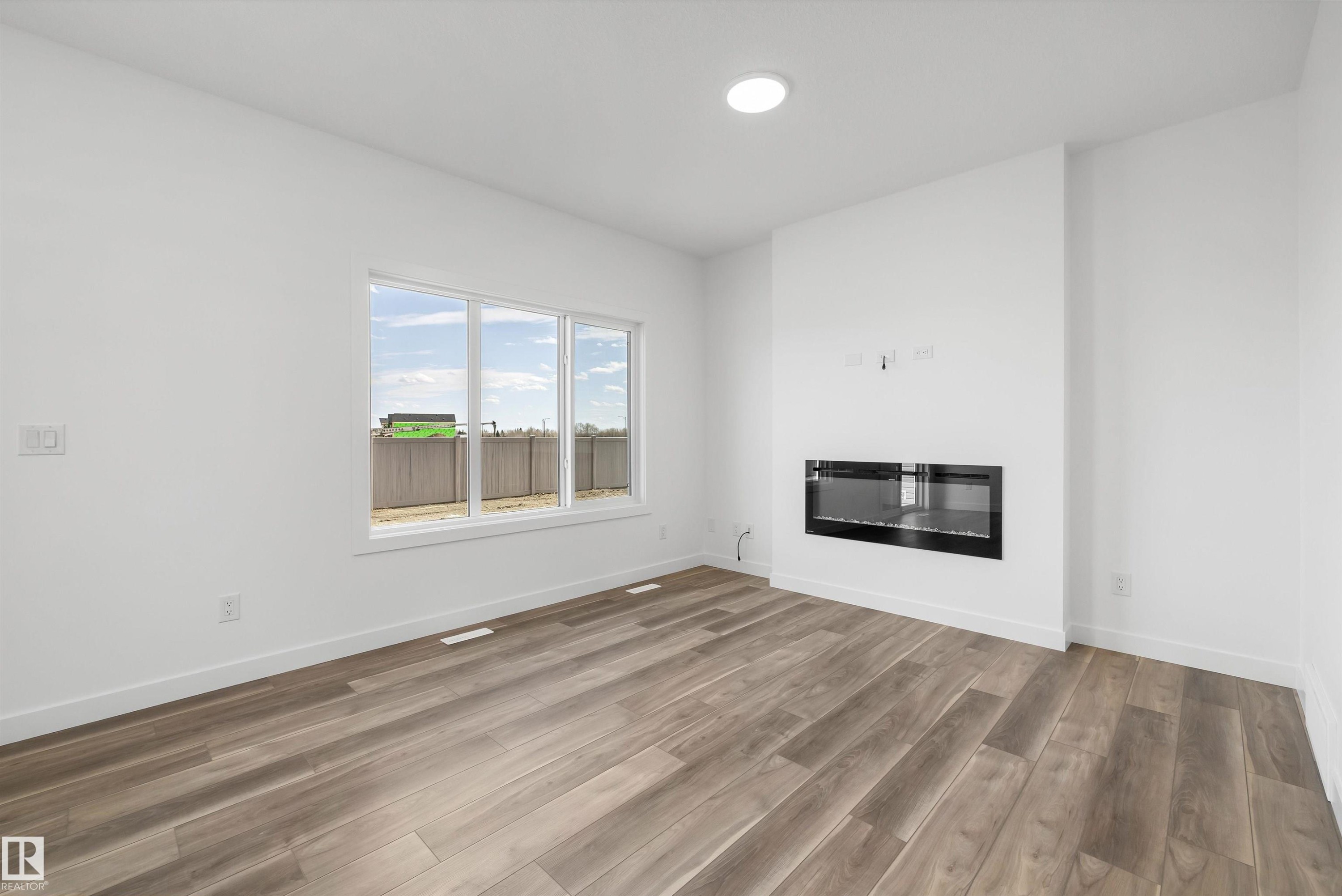 19111 20 Avenue, Edmonton, AB - Indoor Photo Showing Living Room With Fireplace