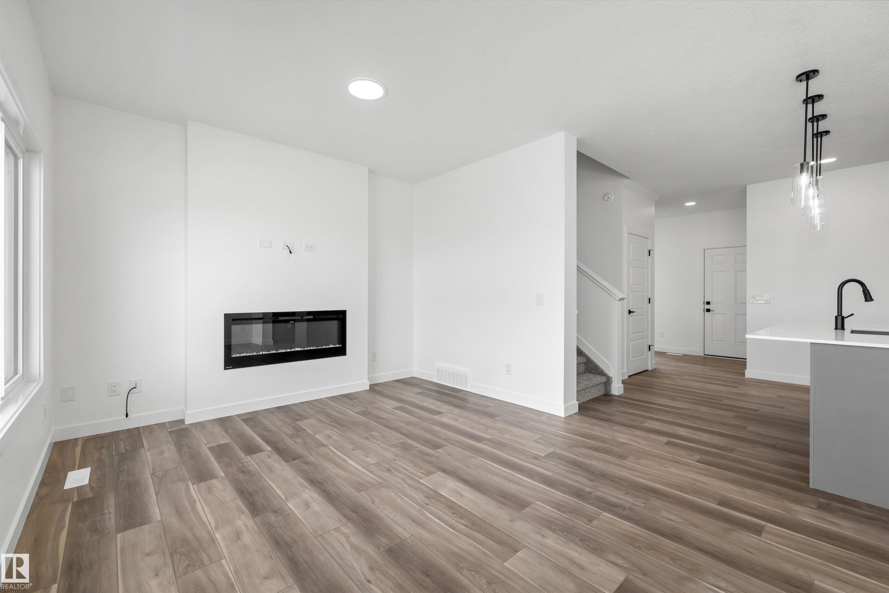 19111 20 Avenue, Edmonton, AB - Indoor Photo Showing Living Room With Fireplace