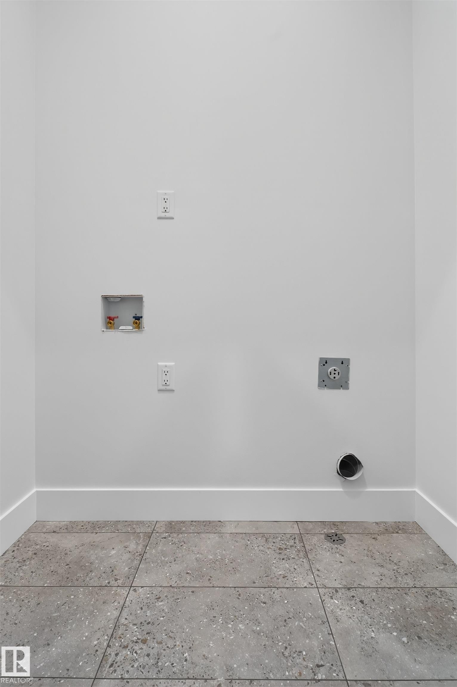 Utility area featuring white walls, a tile floor, and baseboards - 11 Redbud Way, St. Albert, AB - Indoor Photo Showing Other Room