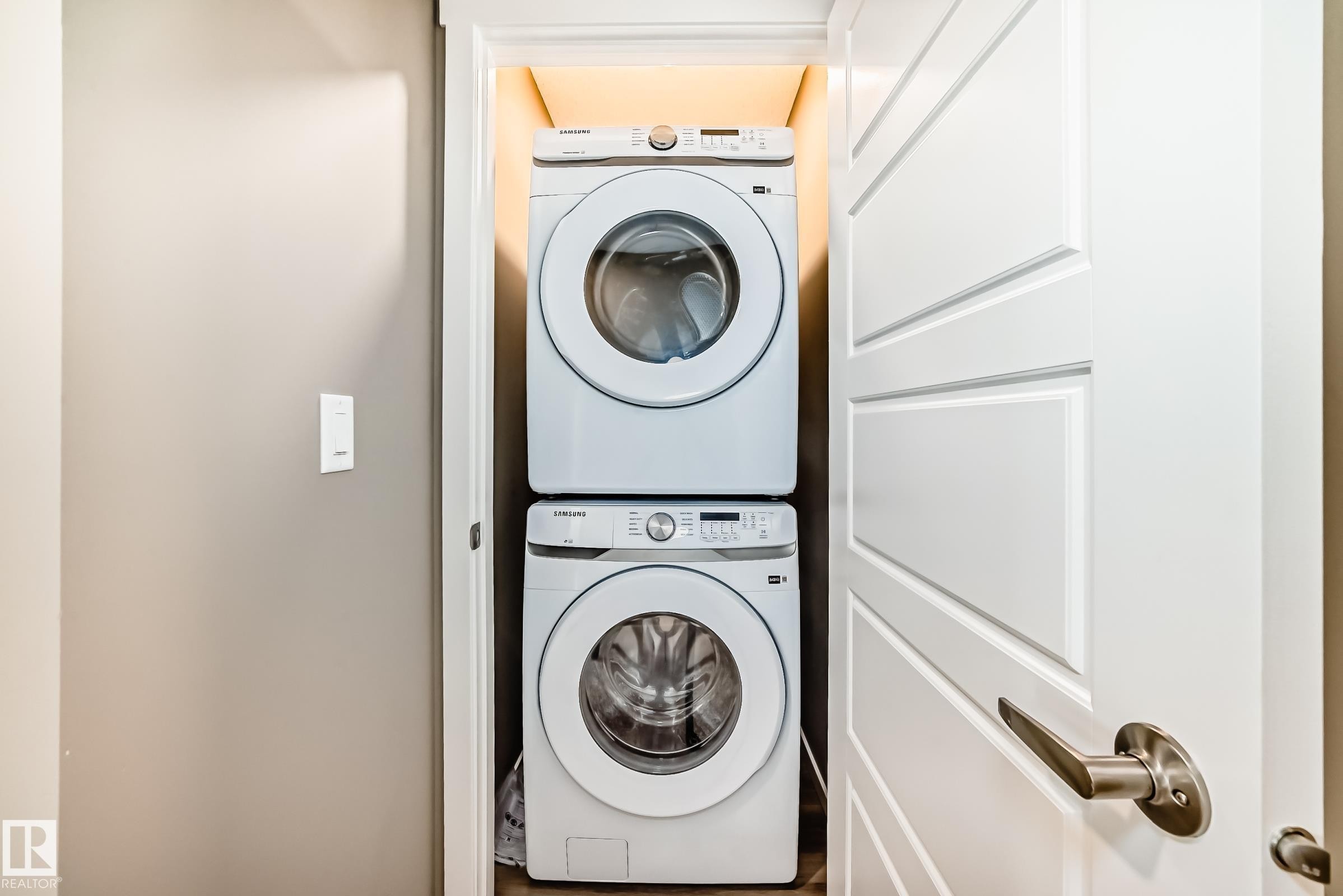 Stackable washer and dryer unit within a dedicated closet - 20415 16 Avenue, Edmonton, AB