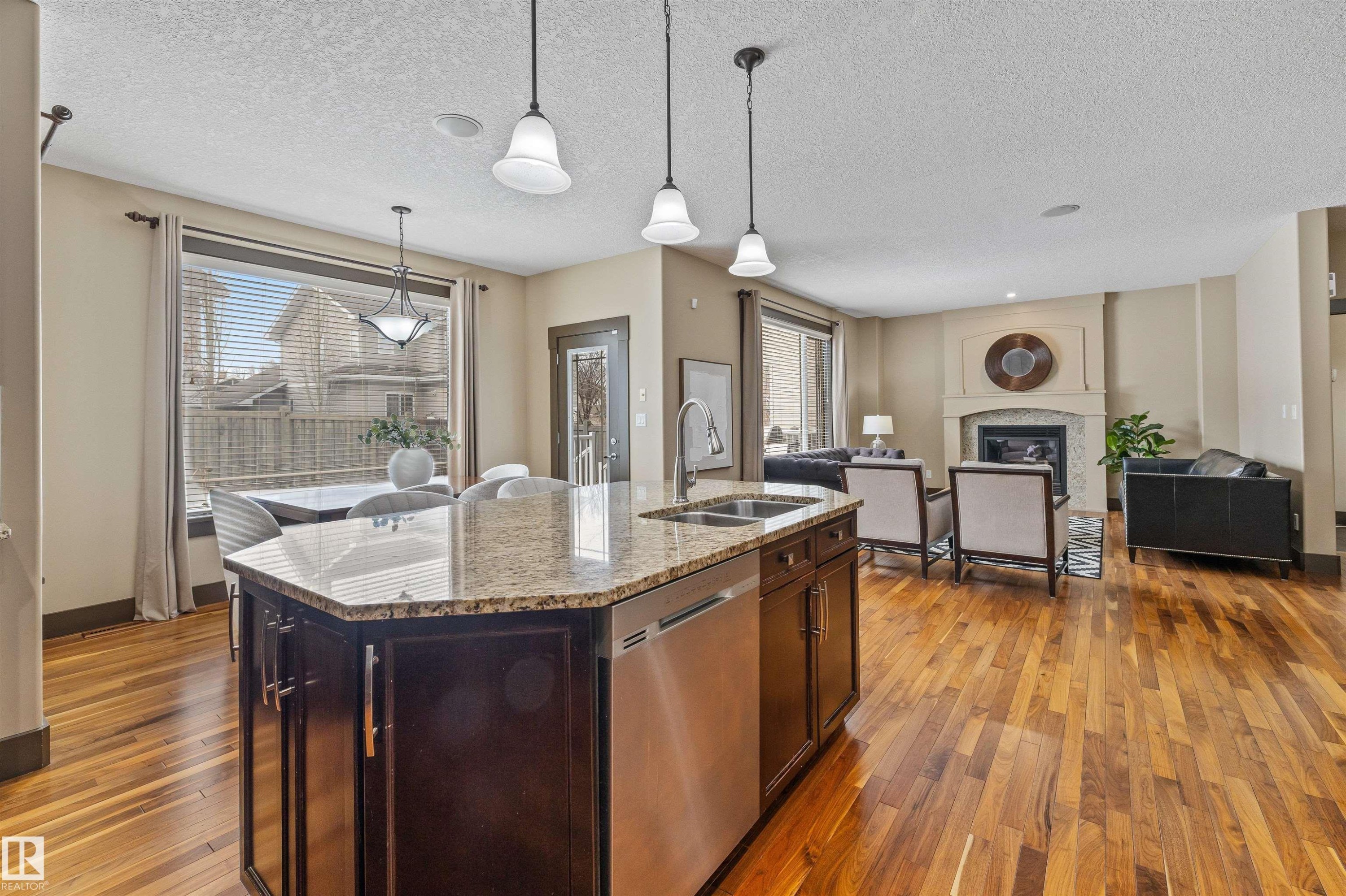 Open concept living space featuring hardwood floors throughout - 1014 Hope Road, Edmonton, AB - Indoor Photo Showing Kitchen With Double Sink With Upgraded Kitchen