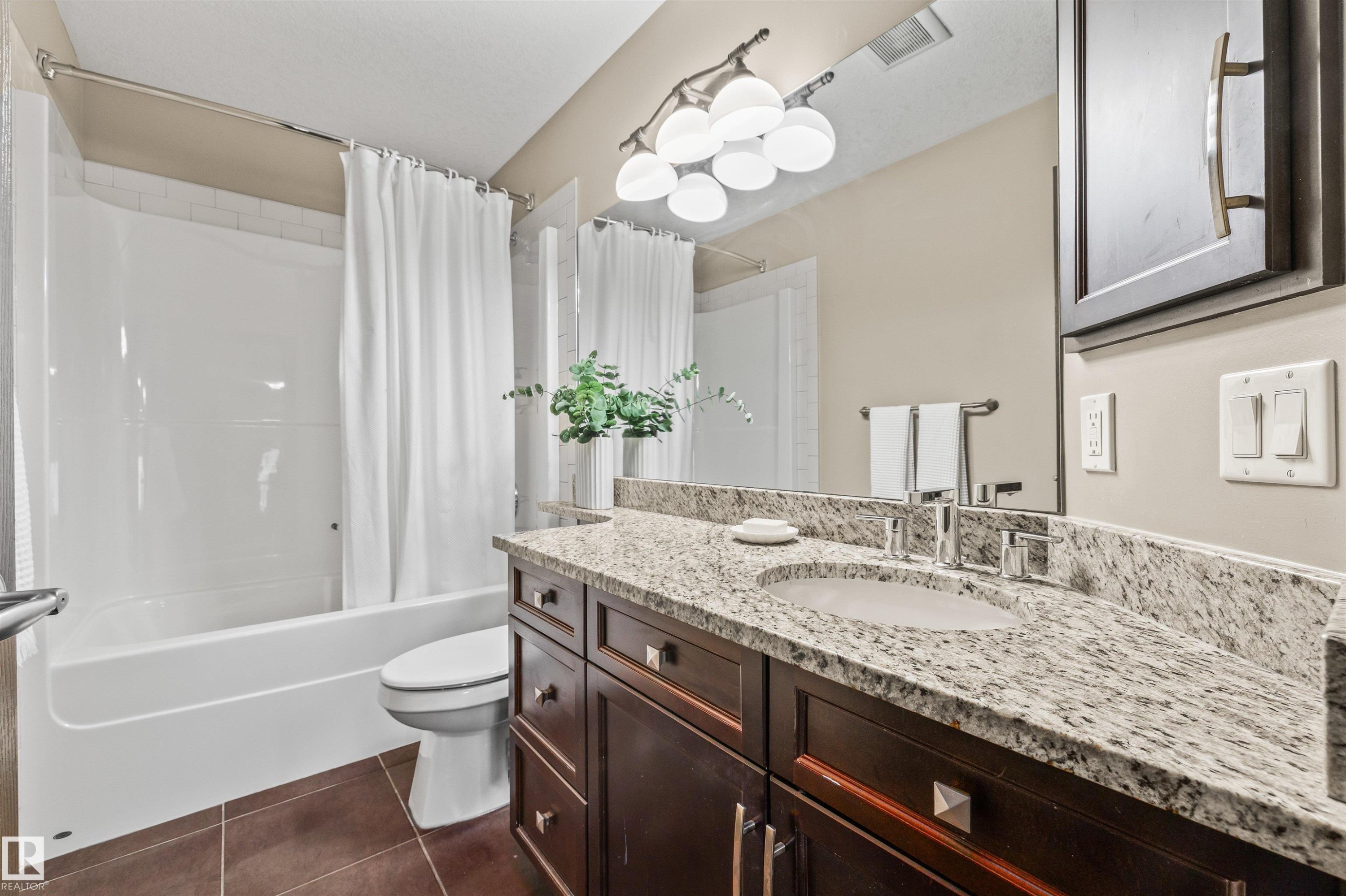 The bathroom features a granite countertop vanity with an integrated sink and a dark wood cabinet - 1014 Hope Road, Edmonton, AB - Indoor Photo Showing Bathroom