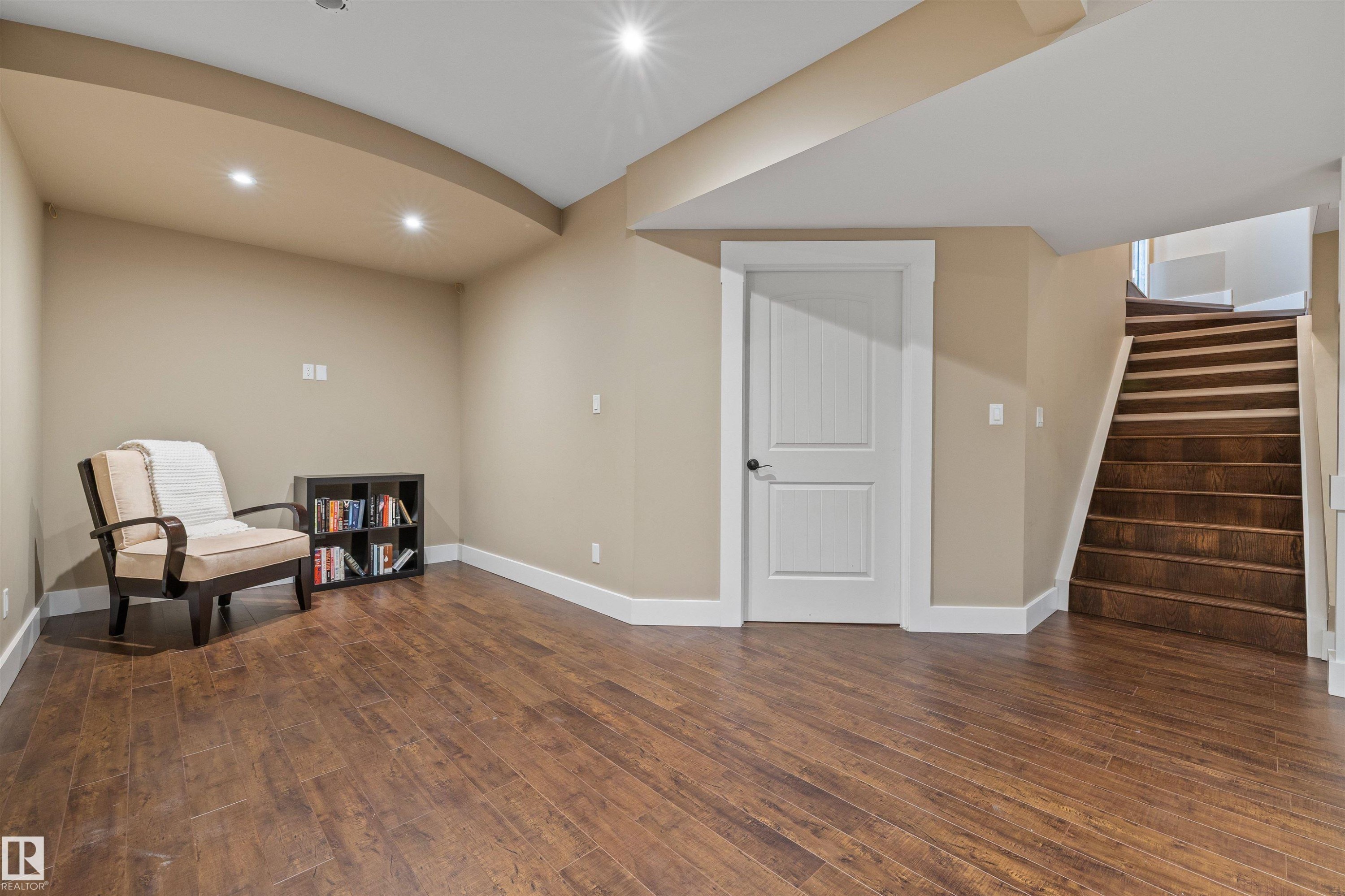 The property features hardwood floors, recessed lighting, and a white interior door with a dark handle - 1014 Hope Road, Edmonton, AB - Indoor