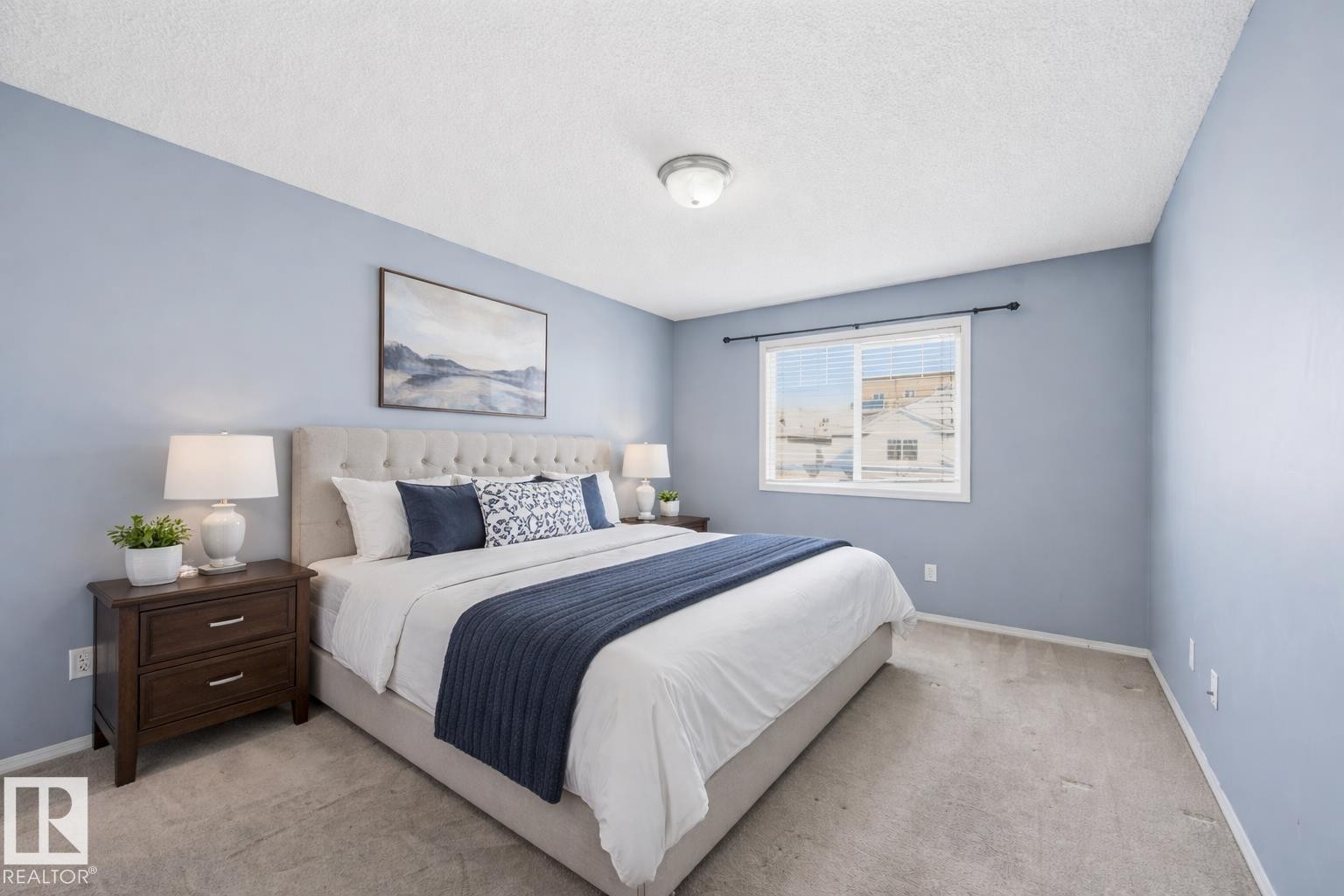 Bedroom featuring light blue walls, gray carpet, a window with horizontal blinds, and a ceiling-mounted light fixture - 53 287 Macewan Road, Edmonton, AB - Indoor Photo Showing Bedroom