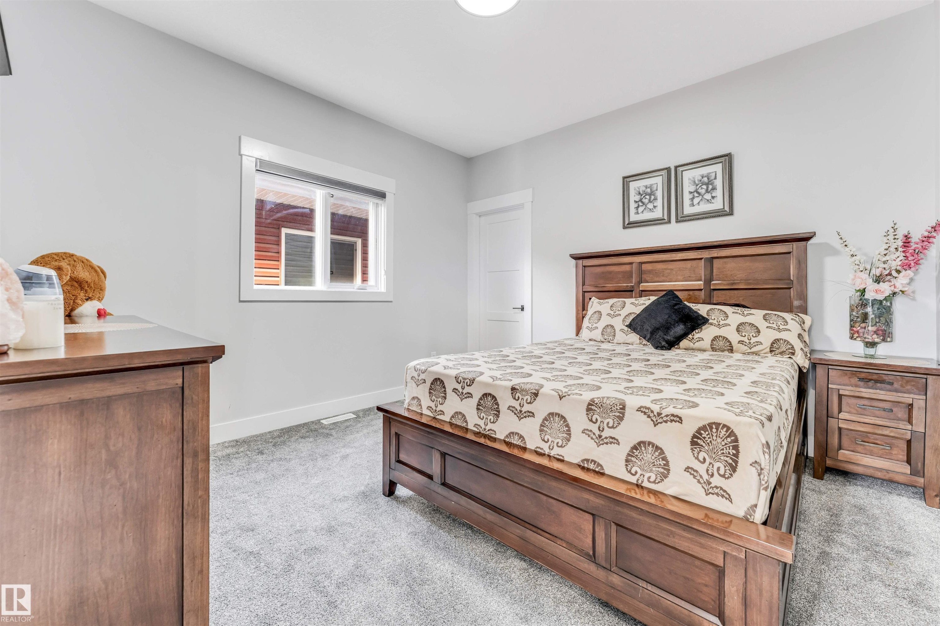 Bedroom featuring light gray walls, gray carpet, and a window with blinds - 1531 151 Avenue, Edmonton, AB - Indoor Photo Showing Bedroom