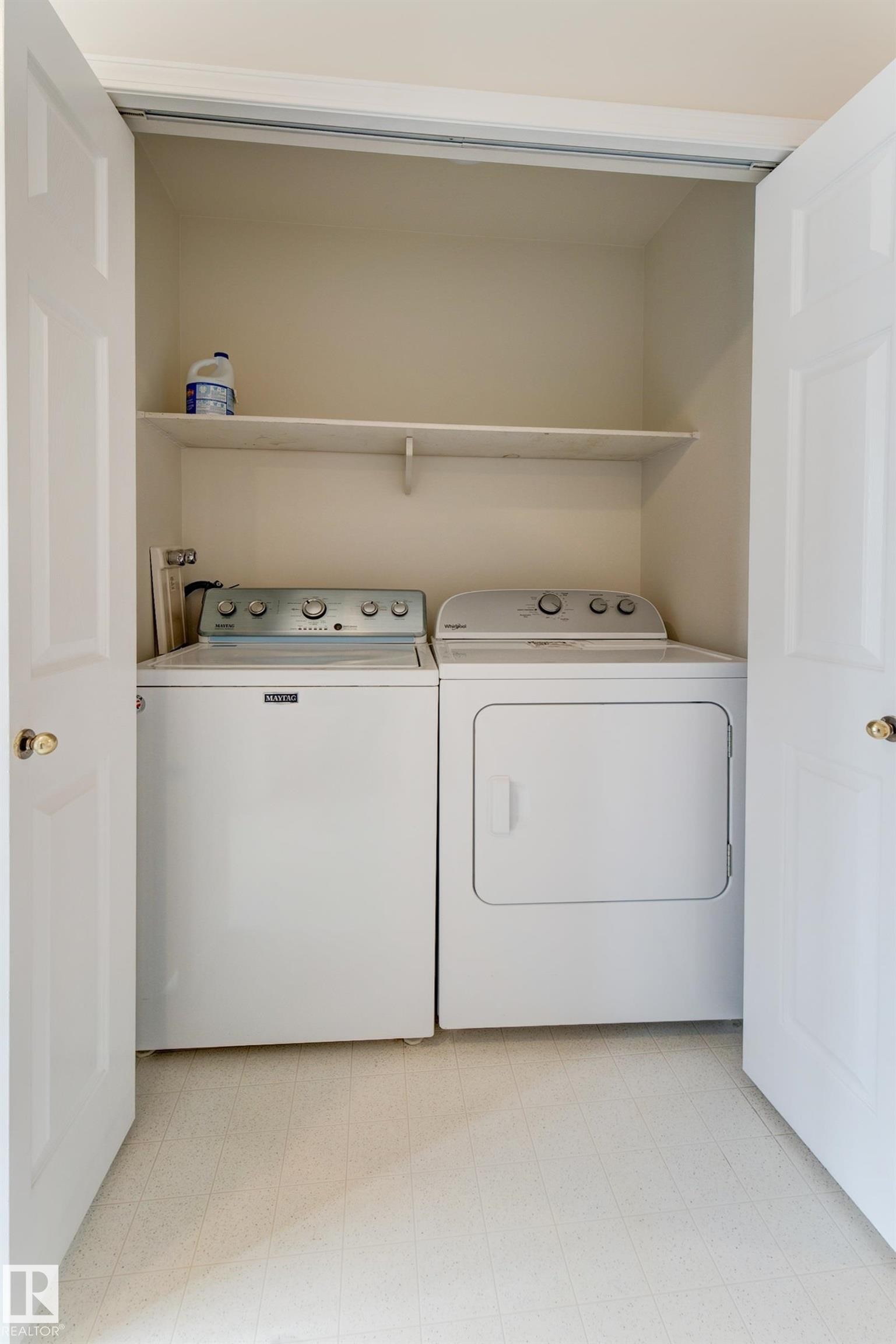 Laundry area featuring white appliances, a white shelf, and light-colored flooring - 5 308 Jackson Road, Edmonton, AB - Indoor Photo Showing Laundry Room