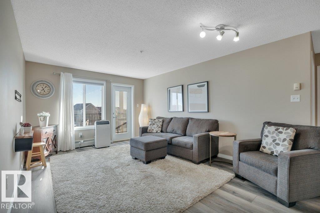 314 111 Edwards Drive, Edmonton, AB - Indoor Photo Showing Living Room