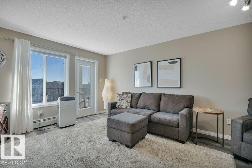 314 111 Edwards Drive, Edmonton, AB - Indoor Photo Showing Living Room