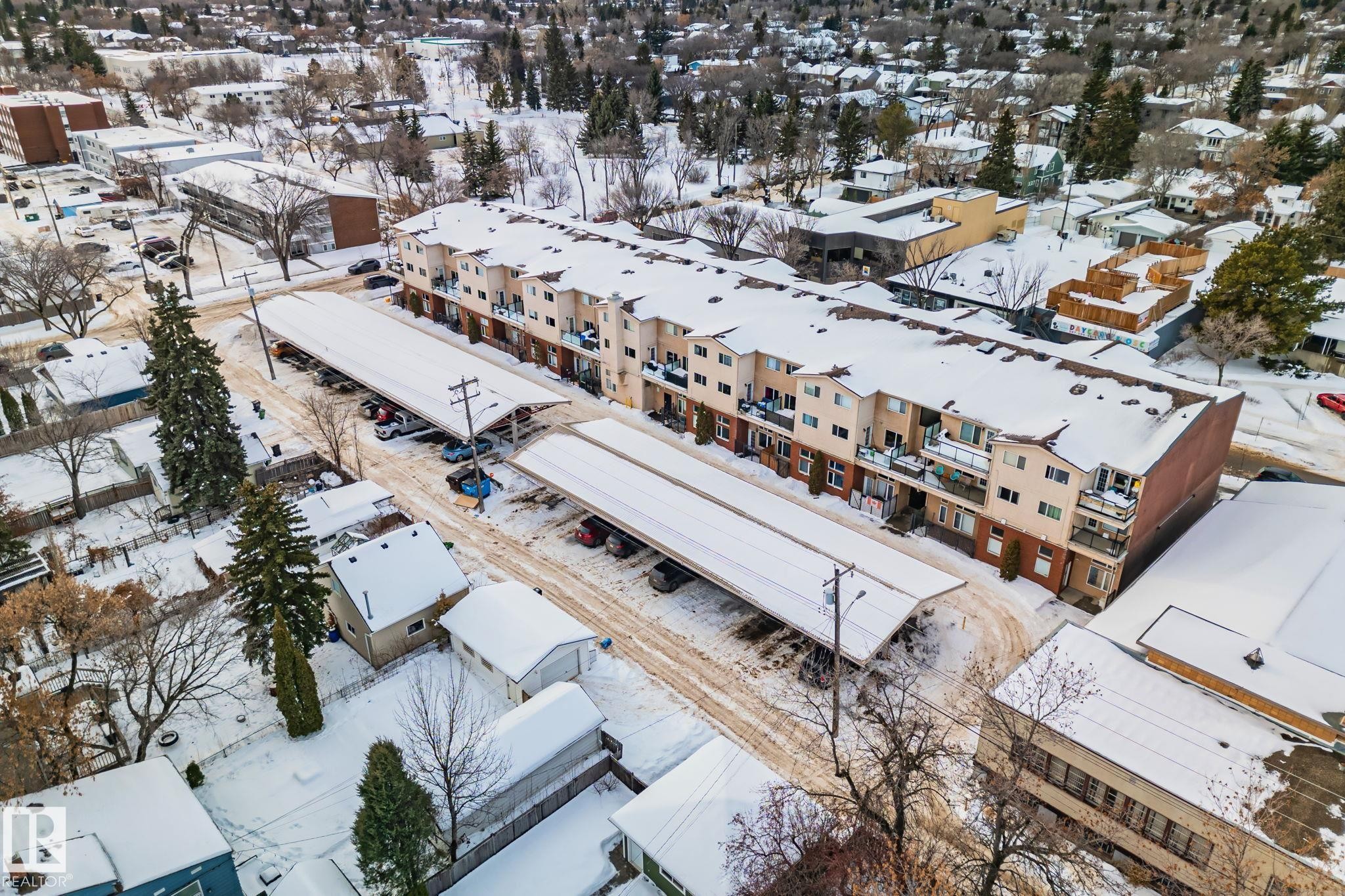 Aerial view of the property, showcasing its multi-story design and carports - 116 11033 127 Street, Edmonton, AB - Outdoor With View