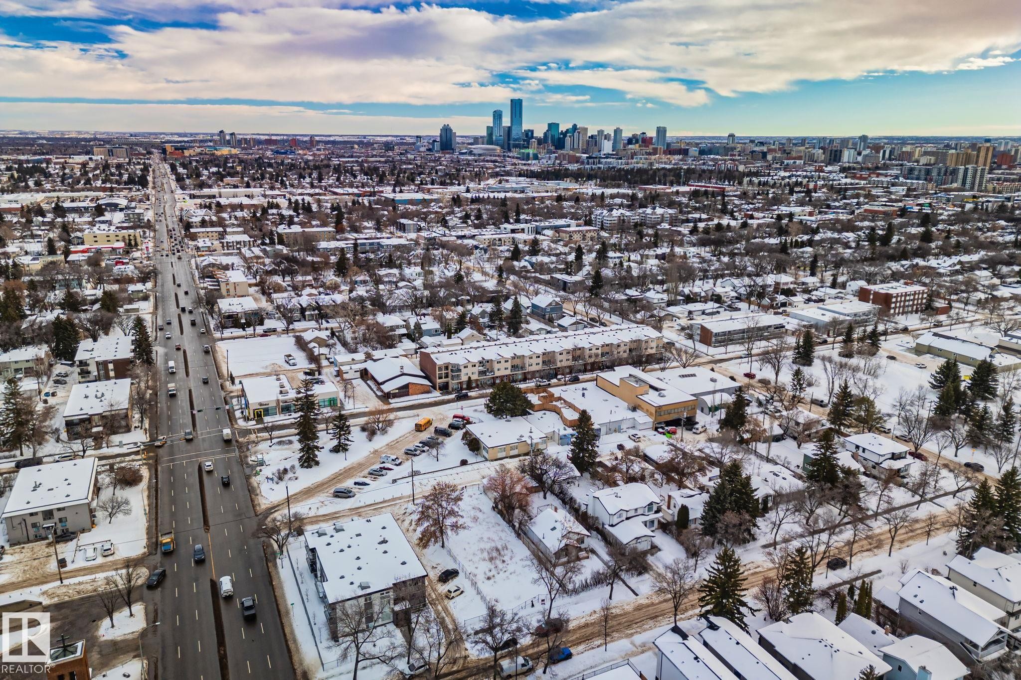 The property is located in a community with an extensive road network and a downtown skyline visible in the distance - 116 11033 127 Street, Edmonton, AB - Outdoor With View