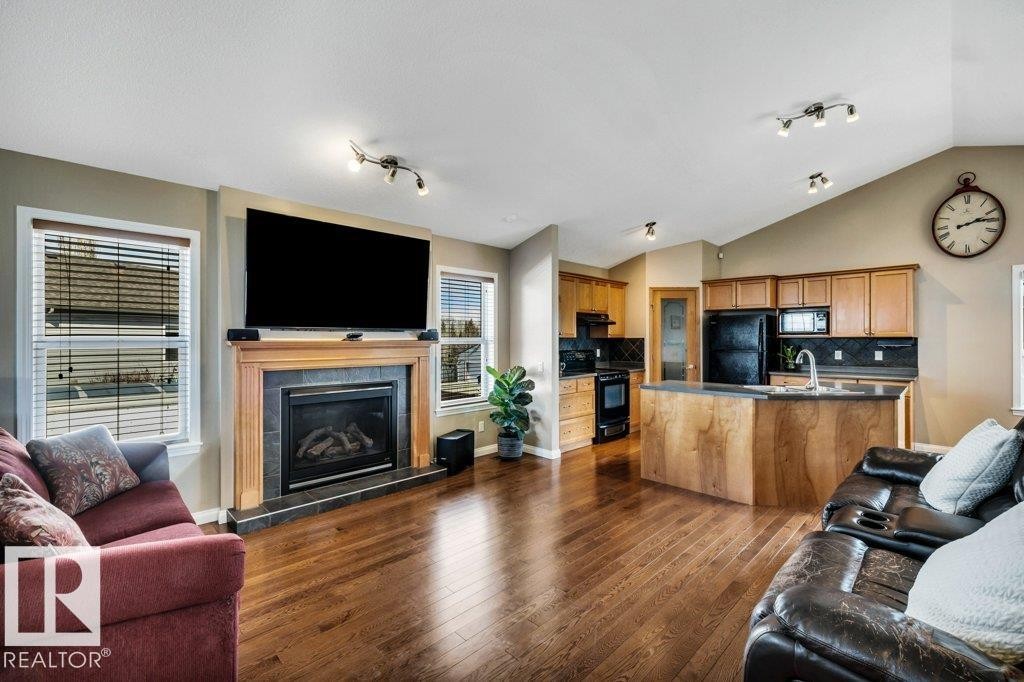 253 Birchwood Drive, Devon, AB - Indoor Photo Showing Living Room With Fireplace