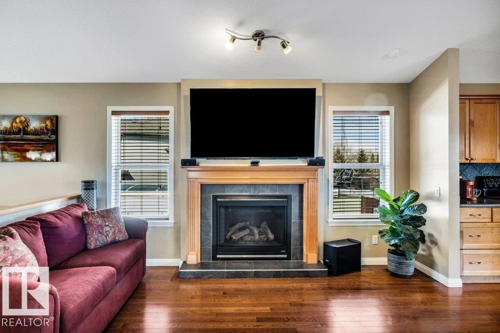 253 Birchwood Drive, Devon, AB - Indoor Photo Showing Living Room With Fireplace