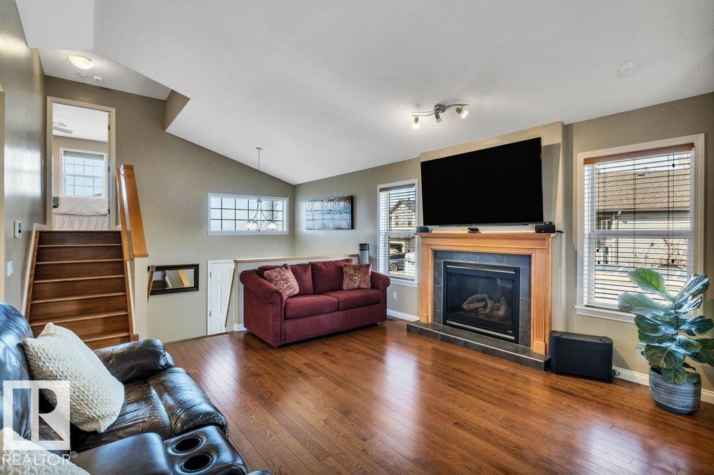 253 Birchwood Drive, Devon, AB - Indoor Photo Showing Living Room With Fireplace