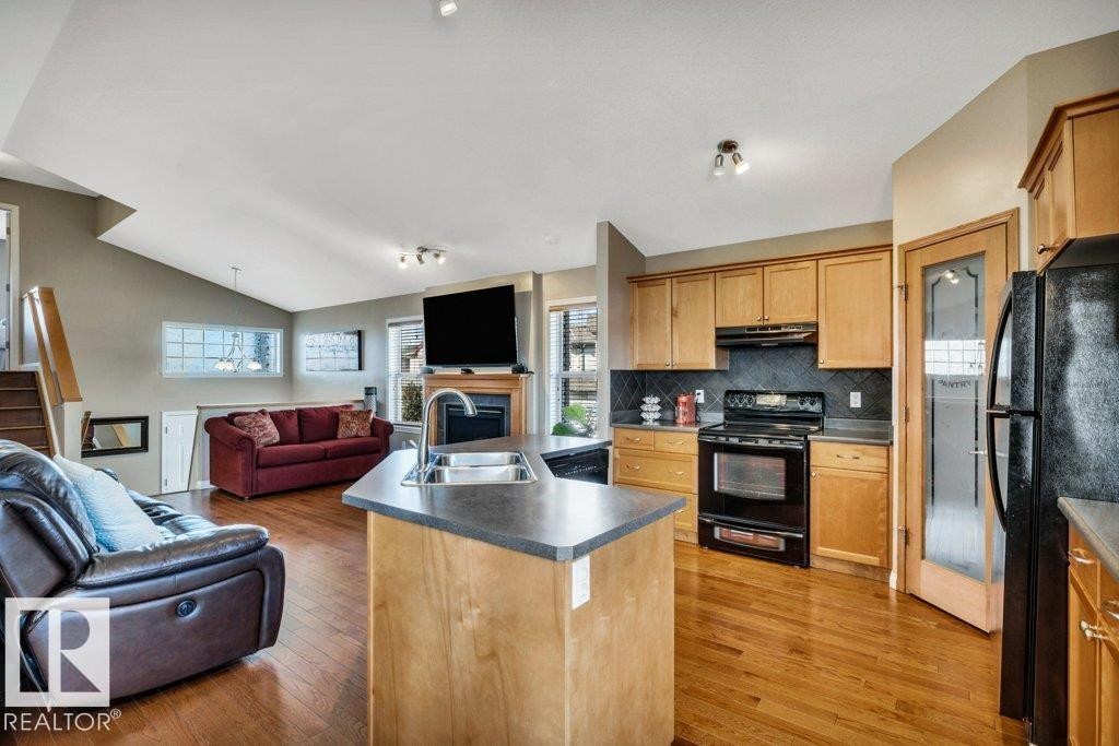 253 Birchwood Drive, Devon, AB - Indoor Photo Showing Other Room With Fireplace