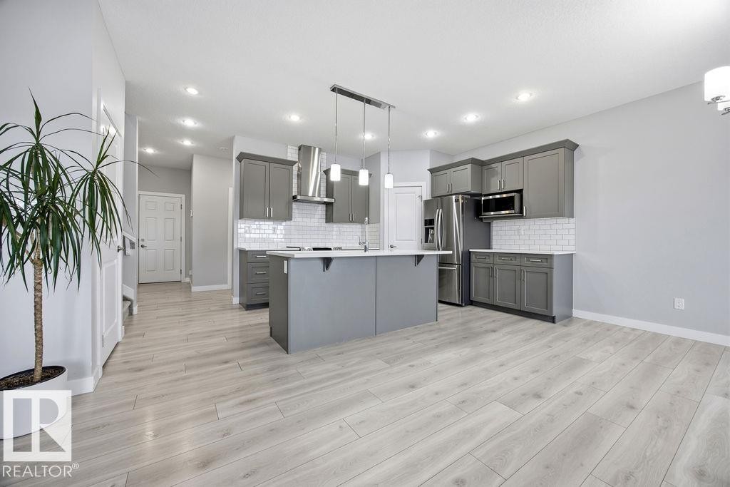 1057 Coopers Hawk Link, Edmonton, AB - Indoor Photo Showing Kitchen With Upgraded Kitchen