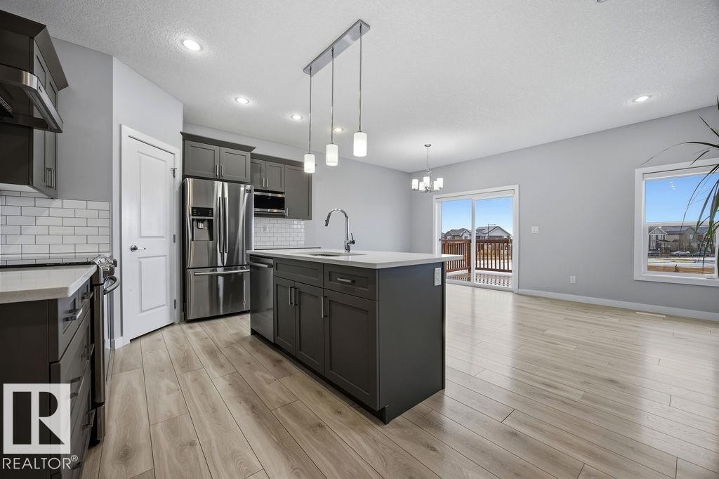 1057 Coopers Hawk Link, Edmonton, AB - Indoor Photo Showing Kitchen With Stainless Steel Kitchen With Upgraded Kitchen