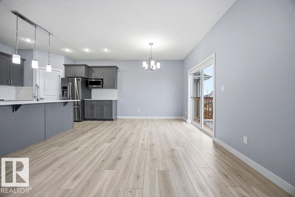 1057 Coopers Hawk Link, Edmonton, AB - Indoor Photo Showing Kitchen With Upgraded Kitchen