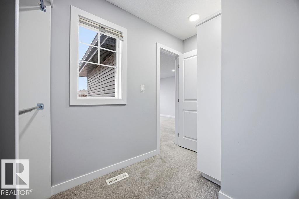 1057 Coopers Hawk Link, Edmonton, AB - Indoor Photo Showing Other Room